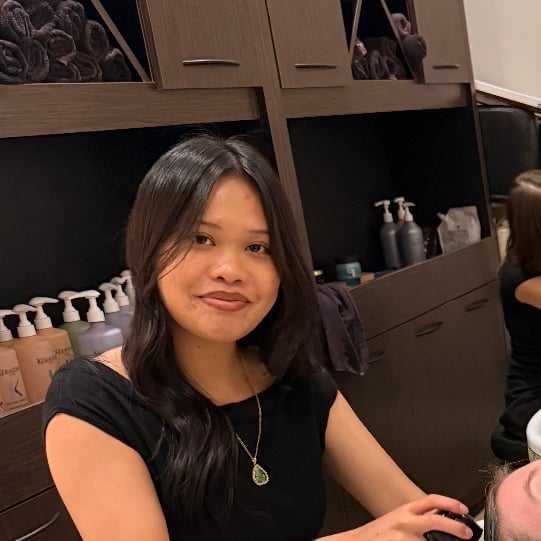 Portrait of Emily Snguon, a professional stylist at Salon Khouri, showcasing their expertise and style.